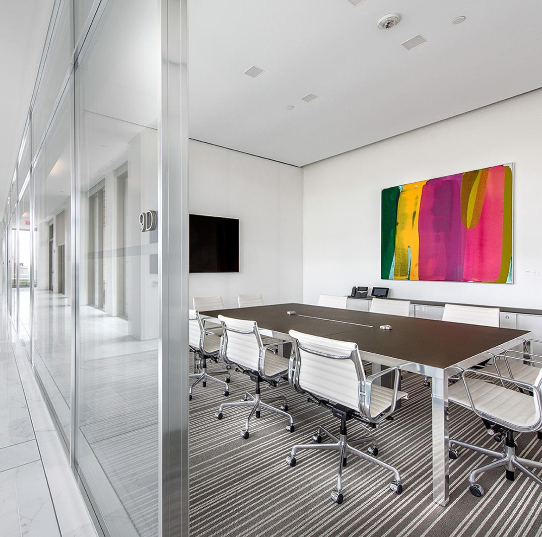 Outside a Miller & Chevalier conference room with vibrant artwork